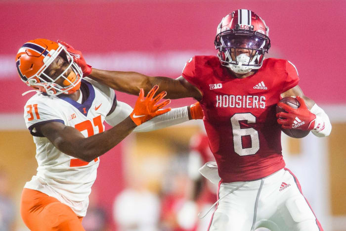 Indiana's Cam Camper (6) stiff arms Illinois' Devon Witherspoon (31) during the Indiana versus Illinois football game at Memorial Stadium on Friday, Sept. 2, 2022.